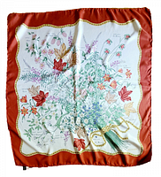 Full view of silk twill scarf showing floral print and red border
