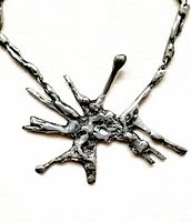 Close-up of pewter abstract splatter pendant