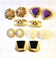 All six pairs of shoe clips arranged in two columns