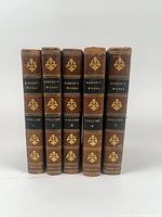 Spine view of all five volumes showing gilt decoration, volume numbers, and London 1814 imprint