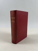 Front cover and spine of burgundy cloth-bound book