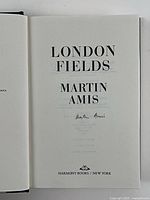 Title page showing book title, author name and signature