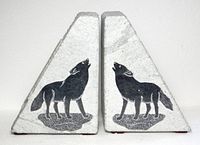 Front view of both soapstone bookends showing wolf motifs