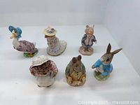 Seven figurines front view