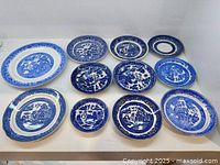 Front view showing all eleven blue and white plates