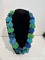 Front view showing full clustered bead design