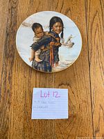 Front view showing painted scene and gold rim