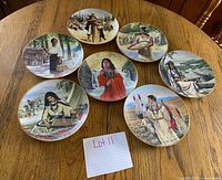 Seven plates front view showing artwork