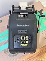 Top view of Remington Rand adding machine showing keypad and logo