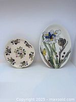 Front view of both bowls showing painted designs