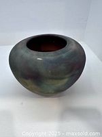 Oblique view showing overall vase form and multicolour glaze