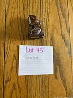 Front view of wood Thunderbird carving