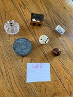 Group shot showing all eight trinket pieces