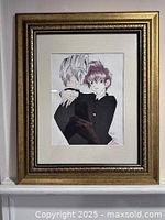 Front view of framed signed artwork