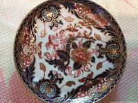 Top view of saucer showing full pattern, colors and gilt work