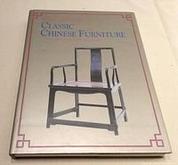 Front of dust jacket showing title and chair illustration