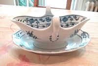 Side view showing gravy boat shape, pattern and attached saucer