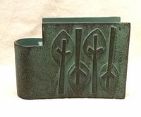 Front view showing tree motif and verdigris finish