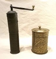 Grinder and canister standing side by side