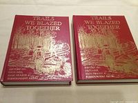 Front covers of both volumes showing title and cover art