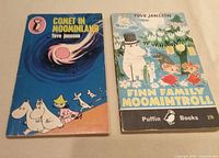 Front covers of both Moomin paperbacks visible
