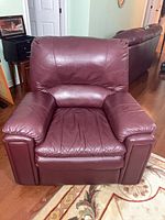 Front view of burgundy faux leather recliner