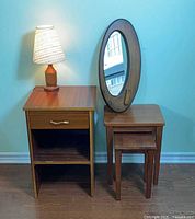 Group shot of nightstand, nesting tables, mirror, and lamp