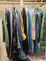 Rack of assorted women’s garments on hangers