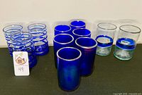 Group shot of all 11 cobalt and clear glasses