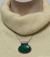 Necklace on mannequin showing full pendant and chain