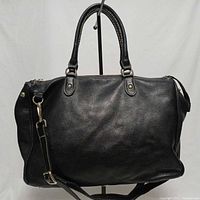 Front view of black leather Roots Grace satchel with handles and shoulder strap