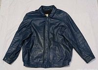 Full front view of blue leather bomber jacket