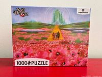 Front of sealed puzzle box displaying artwork and 1000-piece count