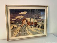 Full view of framed hooked rug artwork