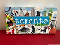 Front of box showing Toronto skyline artwork and title