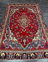 Full view of wool Persian rug showing overall pattern and size