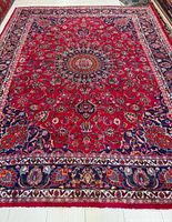 Full overhead view of the Persian rug showing pattern and borders