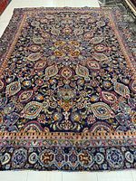 Full view of entire rug showing overall pattern and borders