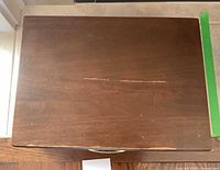 Closed wooden chest top view showing wear