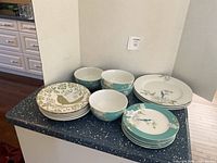 Overall lot showing stacks of plates and bowls