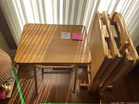 Unfolded tray and folded trays in stand, natural oak wood