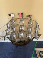 Front view of entire metal sailing ship sculpture