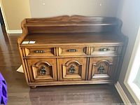 Front view of solid wood sideboard buffet with gallery shelf
