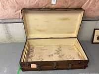 Trunk open showing full interior and exterior hardware