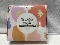 Front of patterned gift box with text