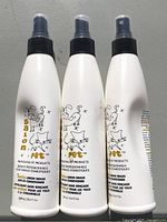 Front view of three Salon Pet conditioner bottles