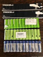 Overall view: two Procell 123 boxes, rows of AA Ni-MH batteries