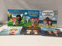 Six children’s books front covers displayed—three standing, three laying