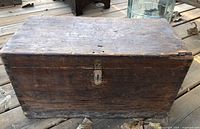 Front and top view showing box, metal hasp, wood grain, wear