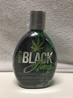 Front view of sealed Millennium Paint It Black Hemp tanning lotion bottle